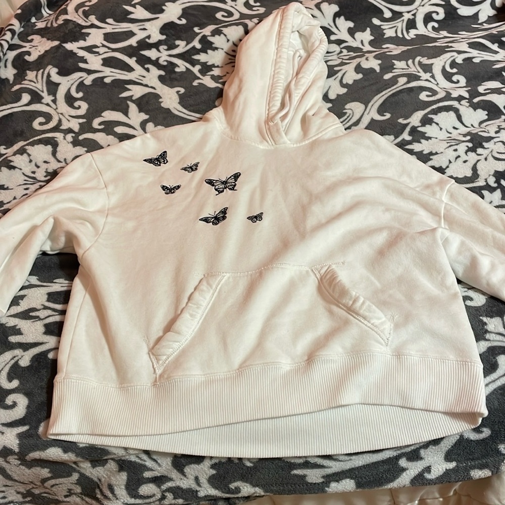 White hoodie with black butterflies on it